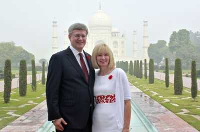 Stephen Harper, Prime Minister of Canada, with wife Laureen pose in front of the Taj Mahal at Agra